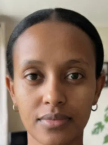 A slightly blurry close-up of a woman’s face