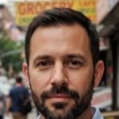 A small, blurry photo of a man’s face, enlarged